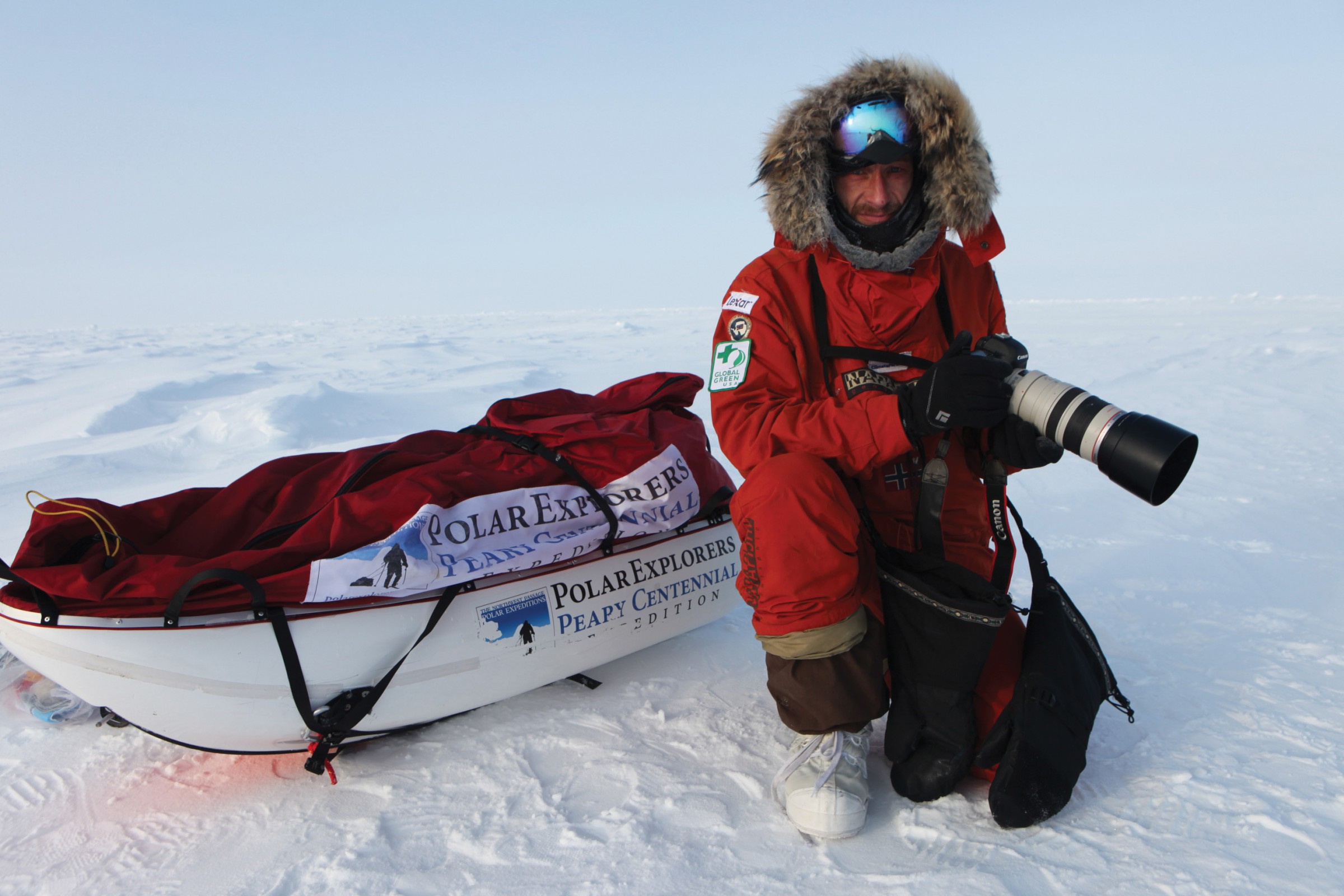 Sebastian Copeland poses with his camera in the Arctic